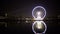 Night Paris view, illuminated Eiffel Tower, Ferris wheel reflection in water