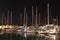 Night parking of yachts in the Croatian ACI marina of the town of Jazira. Burning lights of the evening Mediterranean port with