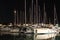 Night parking of yachts in the Croatian ACI marina of the town of Jazira. Burning lights of the evening Mediterranean port with