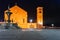 Night photo of ancient street in Rhodes city on Rhodes island, Dodecanese, Greece. Stone walls and bright night lights. Famous