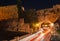 Night photo of ancient street in Rhodes city on Rhodes island, Dodecanese, Greece. Stone walls and bright night lights. Famous