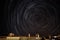 Night photo of a circumpolar with startrails in a suburb of a city