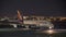 Night photo of a Lufthansa airplane at Miami International airport taxxing