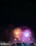 Night photo of New Year\'s arrival (RÃ©veillon) with fireworks in the sky