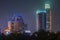 Night photo of skyscrapers over dark Xujiahui park, Shanghai China