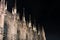 Night photo of the spiers of the Milan Cathedral