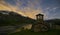 Night photography of a landscape of the Alps. Lake with stars in the sky and moving clouds. Church in the mountain