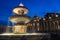 Night picture of Maderno`s fountain and St. Peter`s Basilica at the background during blue hour. Long exposure photo of Maderno