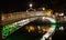 Night picture of the river liffey and Ha penny bridge Dublin Ireland reflections