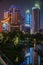 Night portrait of skyscrapers over dark Xujiahui park, Shanghai China