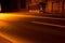 Night roadway illuminated with yellow light