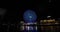 A night rotating ferris wheel at the urban city in Yokohama wide shot