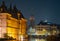 Night scene of The Binnenhof palace in The Hague, next to Hofvijver lake and the clock tower of The Great Church or St. James