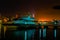 Night scene boats anchor on five cowries creek Victoria island