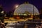 Night scene of the Desert Dome, with the full moon riding on the left side, at Henry Doorly Zoo Omaha Nebraska.