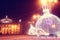 Night scene with illuminated Christmas balls and theater