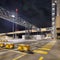 Night scene with illuminated petrochemical production plant and massive pipeline overpass, Antwerp