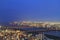 Night scene of Osaka downtown with buildings, river and bridge