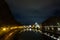 Night scene of Rome, Tevere river with basilica in background