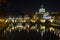 Night scene of Rome, Tevere river with basilica in background