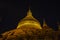 Night scene of Shwezigon golden pagoda, famous for its gold-leaf stupa in Bagan, ancient city of Myanmar, Burma