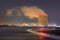 Night scene with view on riverbank with nuclear reactor Doel, Port of Antwerp, Belgium