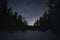 Night scene in winter, starry sky and frozen river, Estonian nature