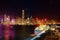 Night scenery of Hong Kong with a majestic skyline of crowded skyscrapers by Victoria Harbour