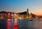 Night scenery of Hong Kong with a majestic skyline of crowded skyscrapers by Victoria Harbour