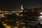 Night scenery Italian city at river by lighted streetlamps