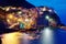 Night scenery of Manarola, an amazing village on vertical cliffs by the rocky coast in Cinque Terre National Park