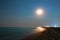 Night seascape and night sky highlighted by Moon
