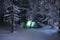 Night shot camping, long exposure, sleeping in the snow outside. Night bivouac in the mountains. Christmas time.