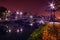 Night shot cityscape on the river with a bridge in the autumn wi