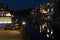 Night shot of a harbor on the Teltow Canal in Berlin-Tempelhof with warehouses and reflections from colorful lights on the water