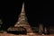 Night shot of incomplete small stupa in the ruins of ancient remains at Wat Mahathat temple.
