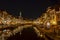 A night shot from the Karnemelksebrug on the New Rhine, decorated with Christmas lights, with a view to the Koornbrug and the towe