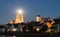 Night shot of Regensburg with moon in the middle of the cathedral towers