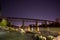 Night shot of train trestle over Sacramento River in Redding, CA