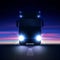 Night silhouette big semi truck with bright headlights and semi riding in the on night road on colorful starry sky background