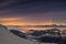 Night sky and aurora over the winter mountains