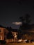 Night sky clouds dark home trees silhouetted