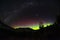 Night sky image of aurora and milky way galaxy in Queenstown, New Zealand