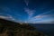 Night sky at Monte Argentario peninsula, Tuscany, Italy. Stars over Giglio Island illuminated by moon light
