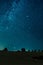 Night sky shot over the field. Milky way galaxy, Andromeda galaxy, Triangle galaxy and Pleiades star cluster is visible in the sky