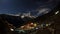 Night sky and stars passing by behind mountain Kongde Ri, Namche Bazaar village. Nepal