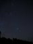 Night sky stars and Pleiades cluster M45 over forest