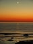 Night sky stars Pleiades Venus and Moon set observing over sea coast