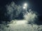 Night snowy rural road lighting lanterns