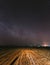 Night Starry Sky With Glowing Stars Above Countryside Road Landscape. Milky Way Galaxy And Rural Field Meadow